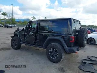 2023 Jeep Wrangler Rubicon with VIN 1C4HJXFGXPW534515, listed as a IAAI auction lot 41524419 with 21,376 mi miles and . Bid and sale history available at DreamBid. Image 3.