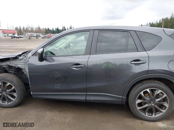 2016 Mazda CX-5 Grand Touring with VIN JM3KE4DY0G0652829, listed as a IAAI auction lot 41786042 with NaN miles. Bid and sale history available at carsss.com. Image 15.