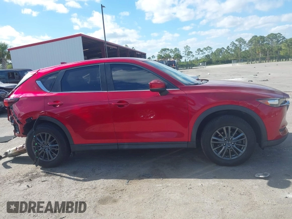 2020 Mazda CX-5 Sport with VIN JM3KFABM7L1819493, listed as a IAAI auction lot 41304240 with 52,940 mi miles. Bid and sale history available at carsss.com. Image 13.