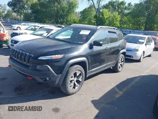 2015 Jeep Cherokee Trailhawk with VIN 1C4PJMBS4FW556822, listed as a IAAI auction lot 42412874 with 129,865 mi miles and . Bid and sale history available at DreamBid. Image 2.