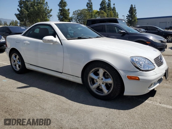 2001 Mercedes-Benz SLK-Class with VIN WDBKK65F81F210099, listed as a Copart auction lot 52606105 with 129,849 mi miles and Salvage Title. Bid and sale history available at carsss.com. Image 4.