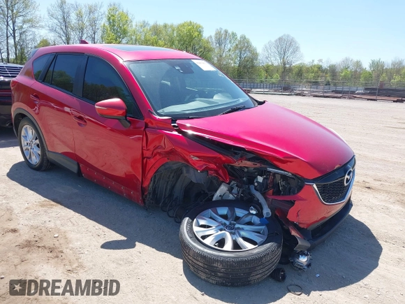 2015 Mazda CX-5 Grand Touring with VIN JM3KE4DY5F0469439, listed as a IAAI auction lot 42053851 with 70,676 mi miles. Bid and sale history available at carsss.com. Image 1.