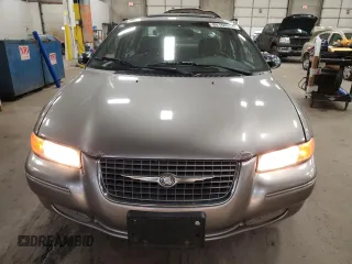 1999 Chrysler Cirrus LXi z VIN 1C3EJ56H4XN528008, wystawiony jako Copart lot #80166314 z przebiegiem 127 767 mil mil oraz Tytuł czysty. Historia ofert i sprzedaży dostępna na DreamBid. Obrazek 5.