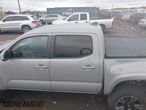 2019 Toyota Tacoma SR z VIN 3TMCZ5AN1KM206969, wystawiony jako IAAI lot #41951159 z przebiegiem 94 875 mil mil oraz . Historia ofert i sprzedaży dostępna na DreamBid. Obrazek 14.