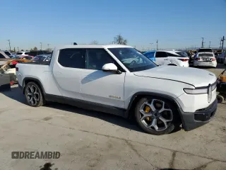 2022 Rivian R1T Adventure z VIN 7FCTGAAA9NN014280, wystawiony jako Copart lot #49723355 z przebiegiem 28 601 mil mil oraz Szkody całkowita. Historia ofert i sprzedaży dostępna na DreamBid. Obrazek 4.