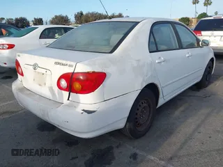 2004 Toyota Corolla CE with VIN JTDBR32E042025208, listed as a IAAI auction lot 41934485 with 299,999 mi miles. Bid and sale history available at carsss.com. Image 4.