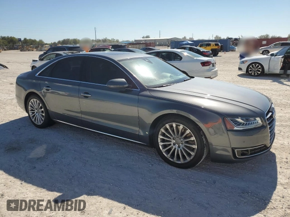 2015 Audi A8 with VIN WAUJGAFD5FN009026, listed as a Copart auction lot 81938904 with 122,880 mi miles and Salvage title. Bid and sale history available at DreamBid. Image 4.
