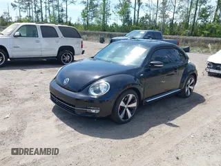 2012 Volkswagen Beetle 2.0T Turbo w/Sun/Snd/Nav PZEV with VIN 3VWVA7AT6CM659395, listed as a IAAI auction lot 41910321 with 132,114 mi miles. Bid and sale history available at carsss.com. Image 2.