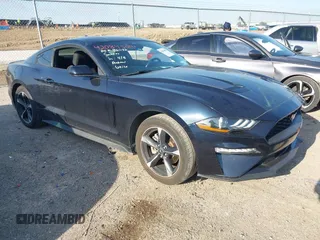 2021 Ford Mustang EcoBoost z VIN 1FA6P8TH0M5107683, wystawiony jako IAAI lot #42084509 z przebiegiem 63 015 mil mil oraz . Historia ofert i sprzedaży dostępna na DreamBid. Obrazek 1.
