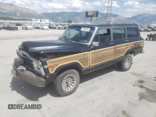 1989 Jeep Grand Wagoneer z VIN 1J4GS5875KP106035, wystawiony jako Copart lot #60903825 z przebiegiem 84 528 mil mil oraz Czysty tytuł • Clean title. Historia ofert i sprzedaży dostępna na DreamBid. Obrazek 1.