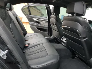 2019 BMW 7 Series 750i with VIN WBA7F0C54KGM25281, listed as a Copart auction lot 84741334 with 76,472 mi miles and Salvage Title. Bid and sale history available at carsss.com. Image 10.