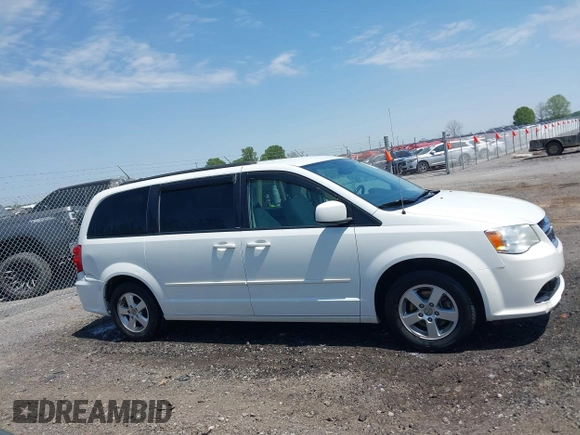 2012 Dodge Grand Caravan SXT with VIN 2C4RDGCG9CR200432, listed as a IAAI auction lot 42027477 with 99,076 mi miles and . Bid and sale history available at DreamBid. Image 13.