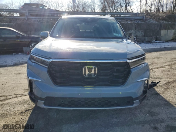 2024 Honda Pilot Touring with VIN 5FNYG1H72RB039998, listed as a Copart auction lot 86590424 with 22,770 mi miles and Salvage Title. Bid and sale history available at carsss.com. Image 5.