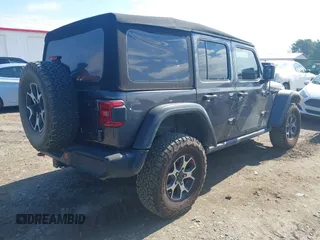 2021 Jeep Wrangler Unlimited Rubicon with VIN 1C4HJXFN5MW509483, listed as a IAAI auction lot 42245703 with 59,461 mi miles and . Bid and sale history available at DreamBid. Image 4.