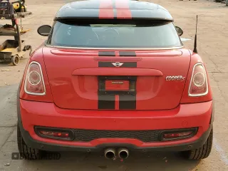 2012 MINI Coupe S z VIN WMWSX3C57CT155013, wystawiony jako Copart lot #88066275 z przebiegiem 69 870 mil mil oraz Szkody całkowita. Historia ofert i sprzedaży dostępna na DreamBid. Obrazek 6.
