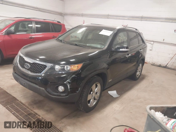 2012 Kia Sorento EX with VIN 5XYKUDA67CG306585, listed as a IAAI auction lot 42150969 with 128,792 mi miles. Bid and sale history available at carsss.com. Image 2.