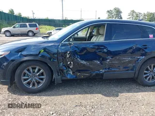 2021 Mazda CX-9 Touring with VIN JM3TCBCY7M0507699, listed as a IAAI auction lot 42603614 with 62,635 mi miles and . Bid and sale history available at DreamBid. Image 6.