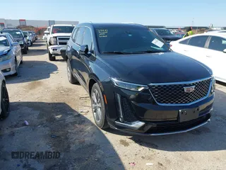 2022 Cadillac XT6 Premium Luxury z VIN 1GYKPCRS3NZ156413, wystawiony jako IAAI lot #41952856 z przebiegiem 40 046 mil mil oraz . Historia ofert i sprzedaży dostępna na DreamBid. Obrazek 1.