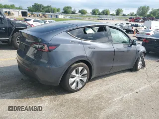 2023 Tesla Model Y Long Range z VIN 7SAYGDEE2PA041350, wystawiony jako Copart lot #56657005 z przebiegiem 25 090 mil mil oraz Szkoda całkowita • Salvage title. Historia ofert i sprzedaży dostępna na DreamBid. Obrazek 3.