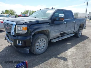 2016 GMC Sierra 2500HD Denali with VIN 1GT12UEG5GF307263, listed as a IAAI auction lot 42214245 with 129,895 mi miles and . Bid and sale history available at DreamBid. Image 2.