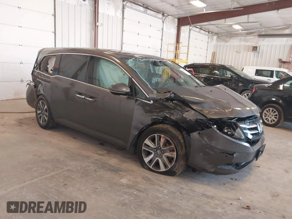 2014 Honda Odyssey Touring with VIN 5FNRL5H99EB105059, listed as a IAAI auction lot 42457672 with 240,581 mi miles and . Bid and sale history available at DreamBid. Image 1.