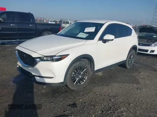 2019 Mazda CX-5 Touring z VIN JM3KFACM0K1564330, wystawiony jako IAAI lot #41797276 z przebiegiem 112 100 mil mil oraz . Historia ofert i sprzedaży dostępna na DreamBid. Obrazek 2.