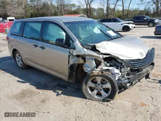 2015 Toyota Sienna L with VIN 5TDZK3DC4FS669496, listed as a IAAI auction lot 41691430 with 119,427 mi miles. Bid and sale history available at carsss.com. Image 1.