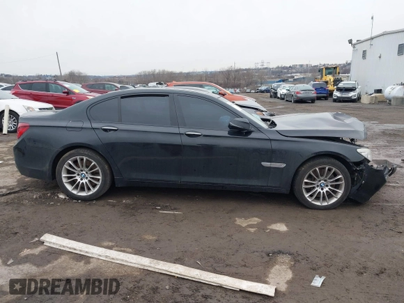 2015 BMW 7 Series 750i xDrive with VIN WBAYB6C59FD965820, listed as a IAAI auction lot 41558215 with 142,617 mi miles. Bid and sale history available at carsss.com. Image 12.