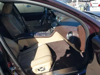 2011 Jaguar XJ with VIN SAJWA1CB8BLV05958, listed as a IAAI auction lot 40799422 with 80,193 mi miles. Bid and sale history available at carsss.com. Image 5.
