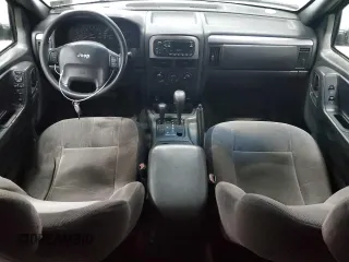 2001 Jeep Grand Cherokee Laredo with VIN 1J4GW48S11C618478, listed as a Copart auction lot 57889965 with Not provided miles and Clean title. Bid and sale history available at DreamBid. Image 8.