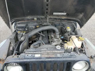 1998 Jeep Wrangler Sport z VIN 1J4FY19S7WP801709, wystawiony jako Copart lot #64495985 z przebiegiem 260 798 mil mil oraz Czysty tytuł • Clean title. Historia ofert i sprzedaży dostępna na DreamBid. Obrazek 11.