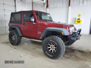 2012 Jeep Wrangler Sport with VIN 1C4AJWAG5CL233049, listed as a Copart auction lot 52328865 with 185,388 mi miles and Salvage title. Bid and sale history available at DreamBid. Image 4.