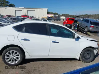 2019 Nissan Sentra S z VIN 3N1AB7AP4KY265082, wystawiony jako IAAI lot #41642989 z przebiegiem 75 937 mil mil oraz . Historia ofert i sprzedaży dostępna na DreamBid. Obrazek 13.