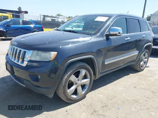 2013 Jeep Grand Cherokee Overland with VIN 1C4RJECT8DC534021, listed as a IAAI auction lot 42058374 with 137,289 mi miles. Bid and sale history available at carsss.com. Image 2.
