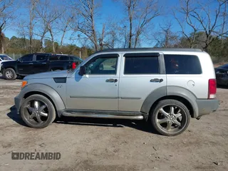 2007 Dodge Nitro SXT with VIN 1D8GT28K97W642118, listed as a IAAI auction lot 41276172 with 385,441 mi miles. Bid and sale history available at carsss.com. Image 14.