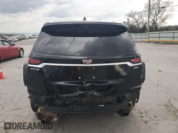 2021 Cadillac XT6 Premium Luxury z VIN 1GYKPCRS1MZ169952, wystawiony jako Copart lot #51908895 z przebiegiem 31 834 mil mil oraz Szkody całkowita. Historia ofert i sprzedaży dostępna na DreamBid. Obrazek 6.