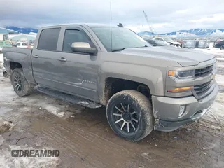 2017 Chevrolet Silverado 1500 LT with VIN 3GCUKREC3HG320603, listed as a IAAI auction lot 41650776 with 148,516 mi miles and . Bid and sale history available at DreamBid. Image 1.