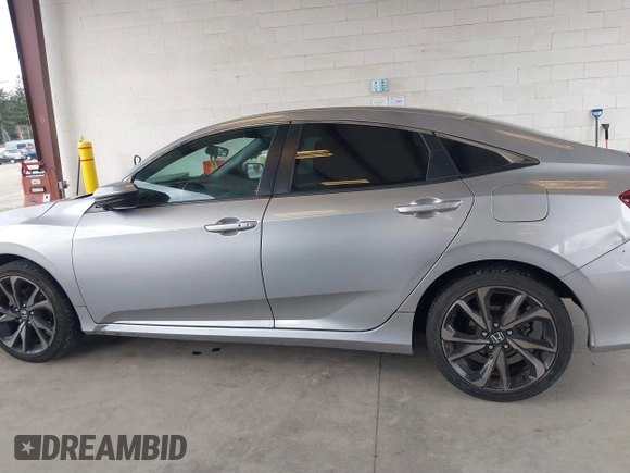 2021 Honda Civic Sport with VIN 2HGFC2F83MH521470, listed as a IAAI auction lot 41828890 with 49,703 mi miles and . Bid and sale history available at DreamBid. Image 14.