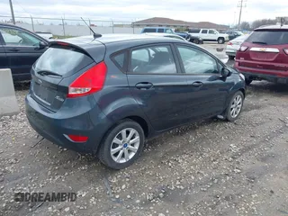 2011 Ford Fiesta SE with VIN 3FADP4EJ4BM228417, listed as a IAAI auction lot 42061494 with 86,873 mi miles. Bid and sale history available at carsss.com. Image 4.