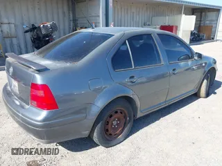 2003 Volkswagen Jetta GL z VIN 3VWRK69M43M117878, wystawiony jako IAAI lot #42553211 z przebiegiem 183 524 mil mil oraz . Historia ofert i sprzedaży dostępna na DreamBid. Obrazek 4.
