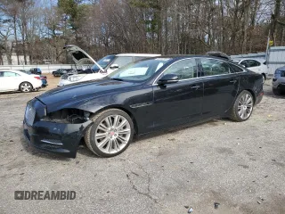 2015 Jaguar XJ with VIN SAJWA2GZ8F8V89379, listed as a Copart auction lot 86655384 with 115,506 mi miles and Salvage Title. Bid and sale history available at carsss.com. Image 1.
