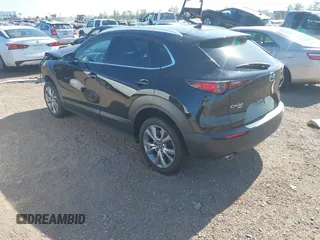 2022 Mazda CX-30 S Premium with VIN 3MVDMBDL6NM407913, listed as a IAAI auction lot 42359860 with 35,804 mi miles and . Bid and sale history available at DreamBid. Image 3.