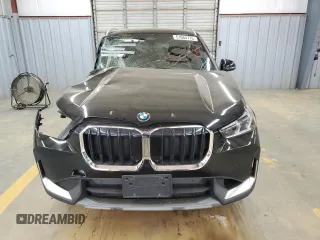 2023 BMW X1 xDrive28i with VIN WBX73EF07P5W50437, listed as a Copart auction lot 51064775 with 0 mi miles and Salvage Title. Bid and sale history available at carsss.com. Image 5.