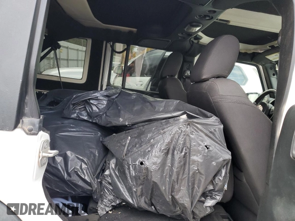 2018 Jeep Wrangler Unlimited Sport S with VIN 1C4BJWDGXJL849522, listed as a Copart auction lot 48964995 with 104,910 mi miles and Salvage title. Bid and sale history available at DreamBid. Image 11.
