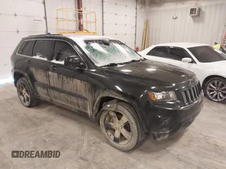 2015 Jeep Grand Cherokee Laredo with VIN 1C4RJFAG3FC607827, listed as a IAAI auction lot 41298397 with 198,171 mi miles. Bid and sale history available at carsss.com. Image 1.