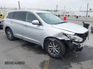 2014 Infiniti QX60 with VIN 5N1AL0MM7EC500070, listed as a IAAI auction lot 42544763 with 189,419 mi miles and . Bid and sale history available at DreamBid. Image 1.