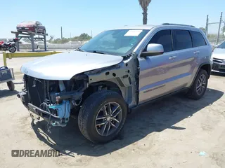 2018 Jeep Grand Cherokee Laredo E with VIN 1C4RJEAG2JC429850, listed as a IAAI auction lot 42541574 with 72,009 mi miles and . Bid and sale history available at DreamBid. Image 18.