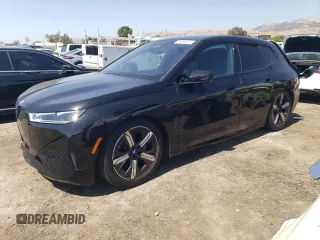 2023 BMW iX M60 with VIN WB533CF0XPCM48411, listed as a Copart auction lot 66606474 with 11,867 mi miles and Salvage Title. Bid and sale history available at carsss.com. Image 1.