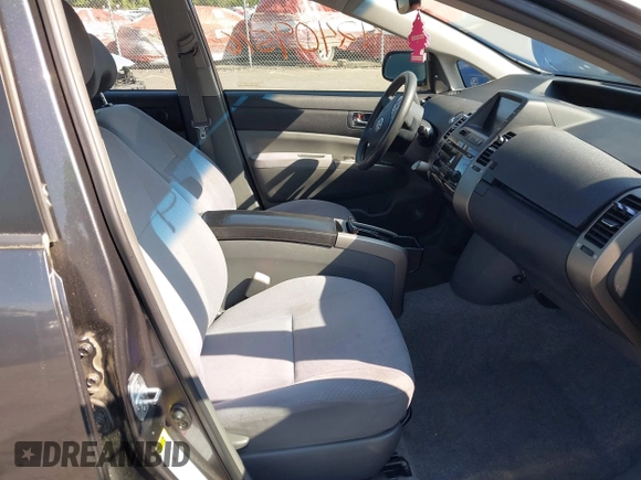 2007 Toyota Prius z VIN JTDKB20U473225645, wystawiony jako IAAI lot #42409516 z przebiegiem 154 050 mil mil oraz . Historia ofert i sprzedaży dostępna na DreamBid. Obrazek 5.