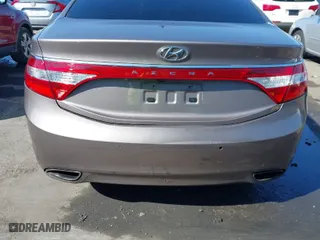 2013 Hyundai Azera with VIN KMHFH4JG2DA256481, listed as a IAAI auction lot 41673405 with 180,130 mi miles. Bid and sale history available at carsss.com. Image 6.